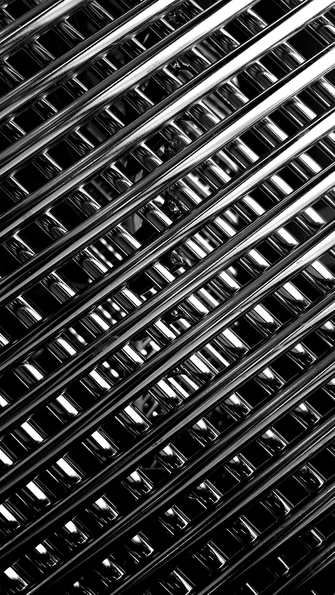 A black and white photo of metal bars